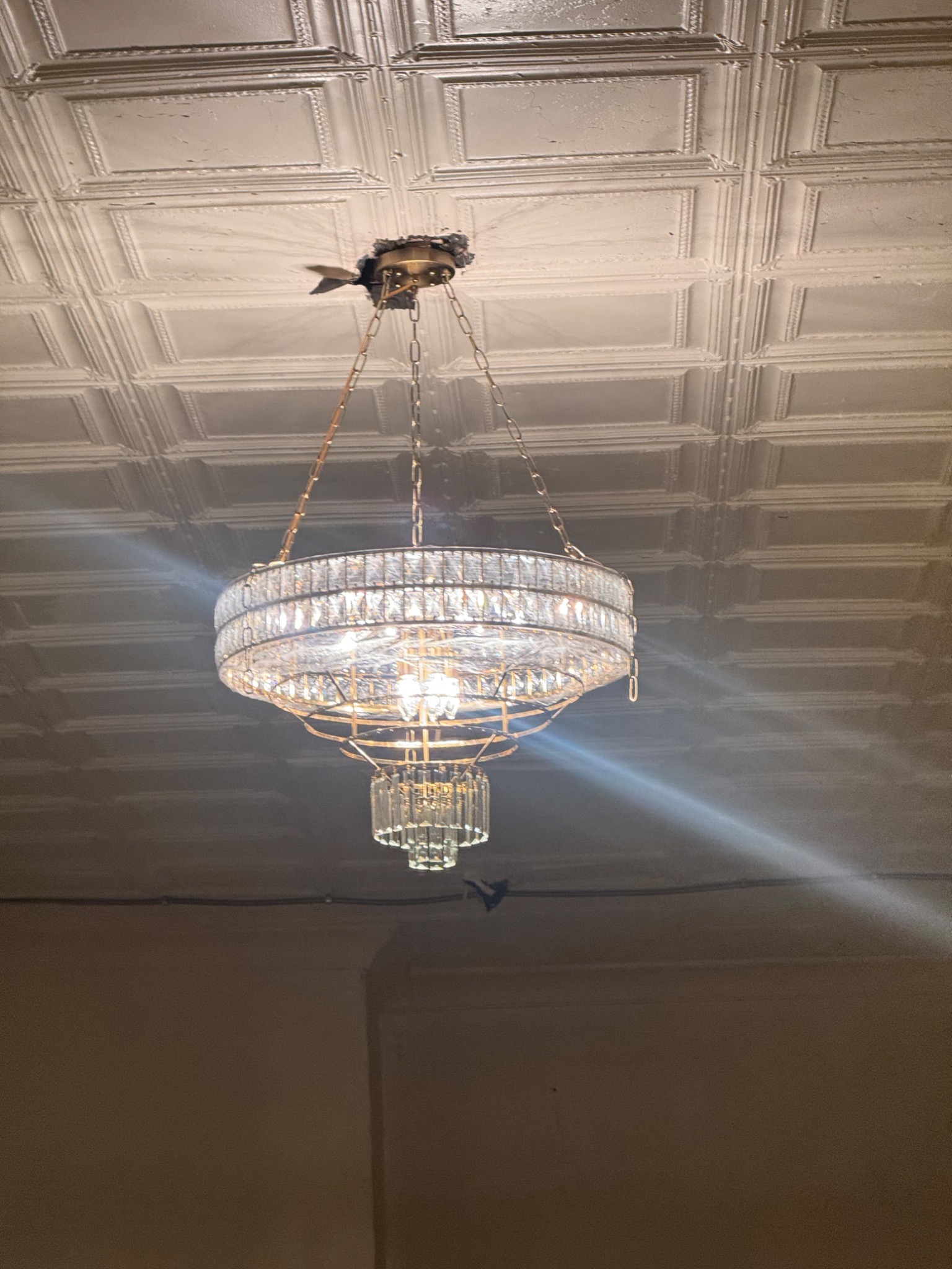 Crystal chandelier and ceiling detail inside Opal Crest Hall
